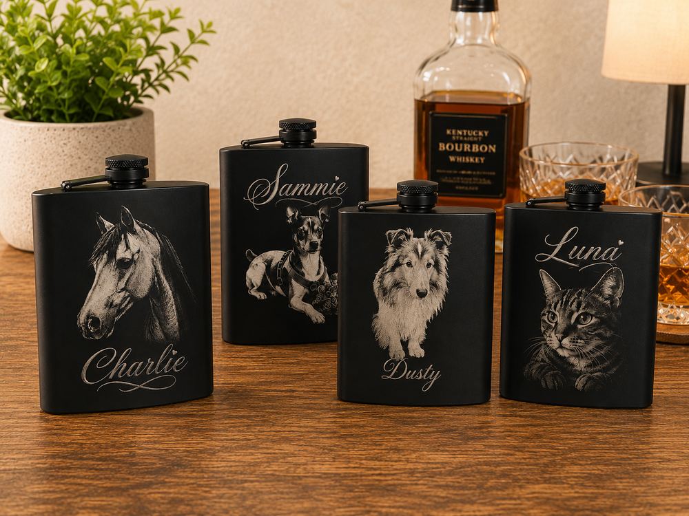 Four black flasks laser engraved with custom pet portraits and names: Charlie, Sammie, Dusty, and Luna